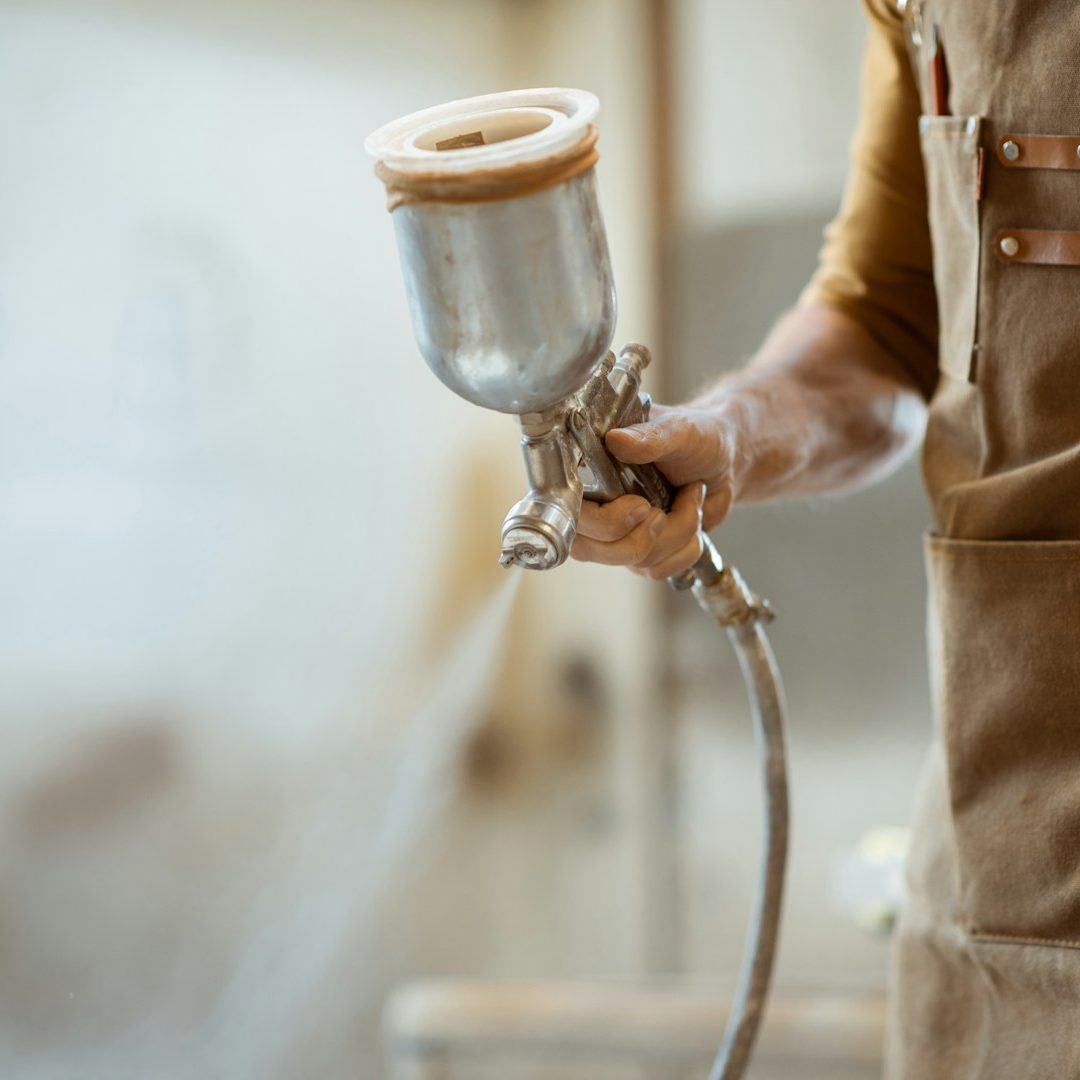a person paint spraying a person paint spraying